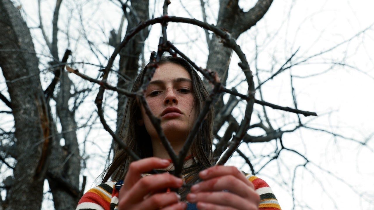 Zelda Adams holds a witchcraft tool in Hellbender