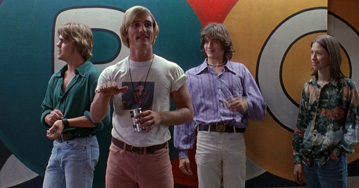 Matthew McConaughey and the cast of Dazed and Confused leaning against a wall.