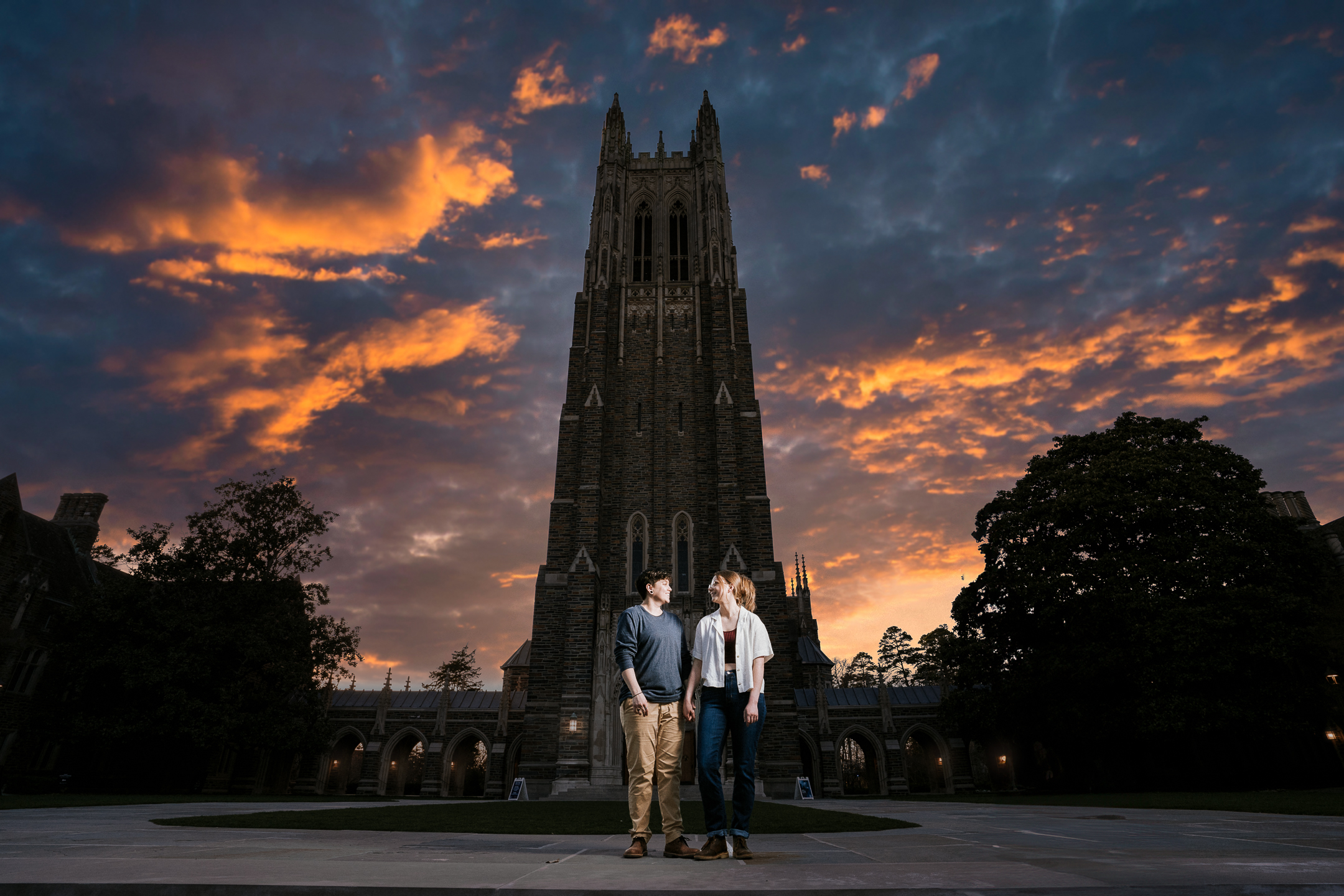 couple in front of tower at sunset