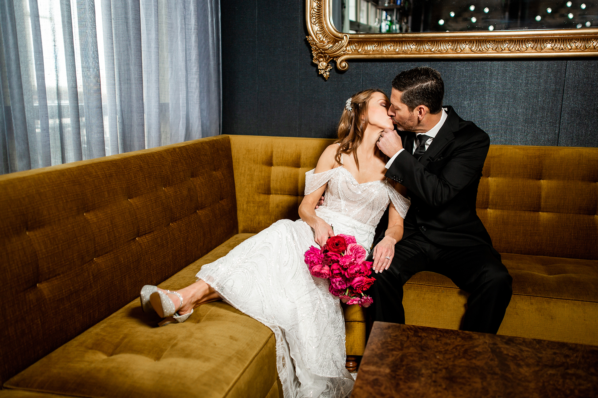 couple kissing on couch