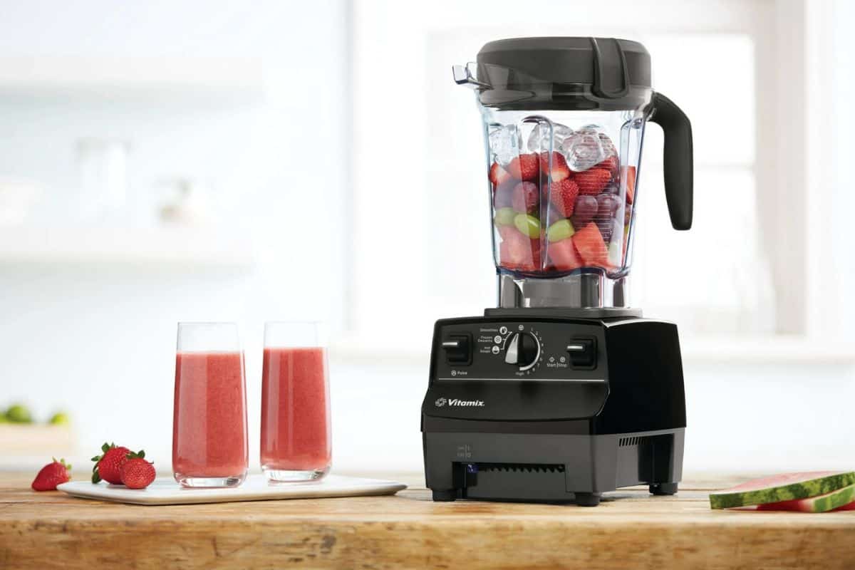 a vitamix blender with two smoothies