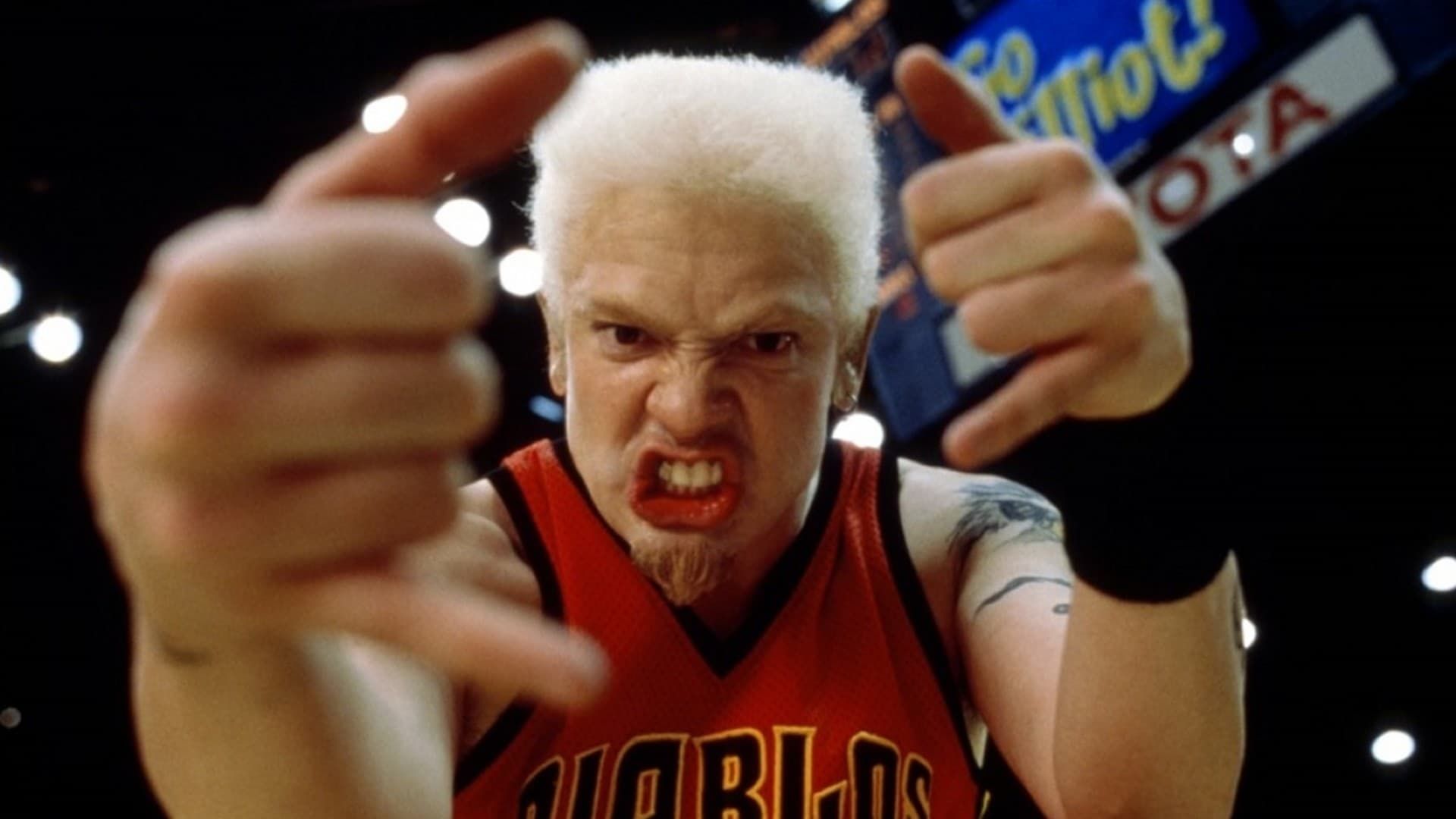 Brendan Fraser in Bedazzled with white hair playing basketball