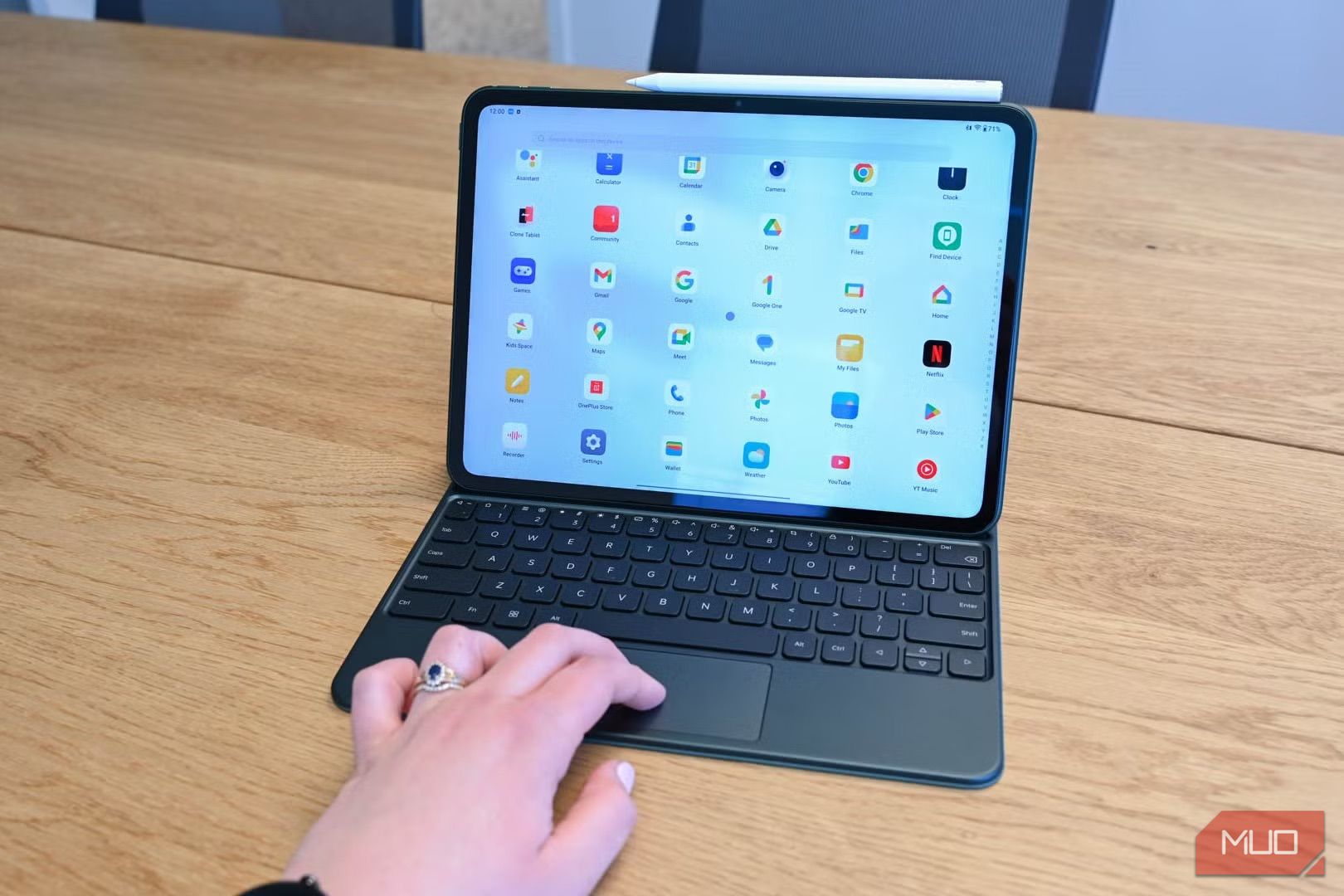 Person using the trackpad on the magnetic keyboard for the OnePlus Pad