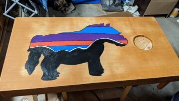 i made a lil sebastian patagonia corn hole board.jpeg