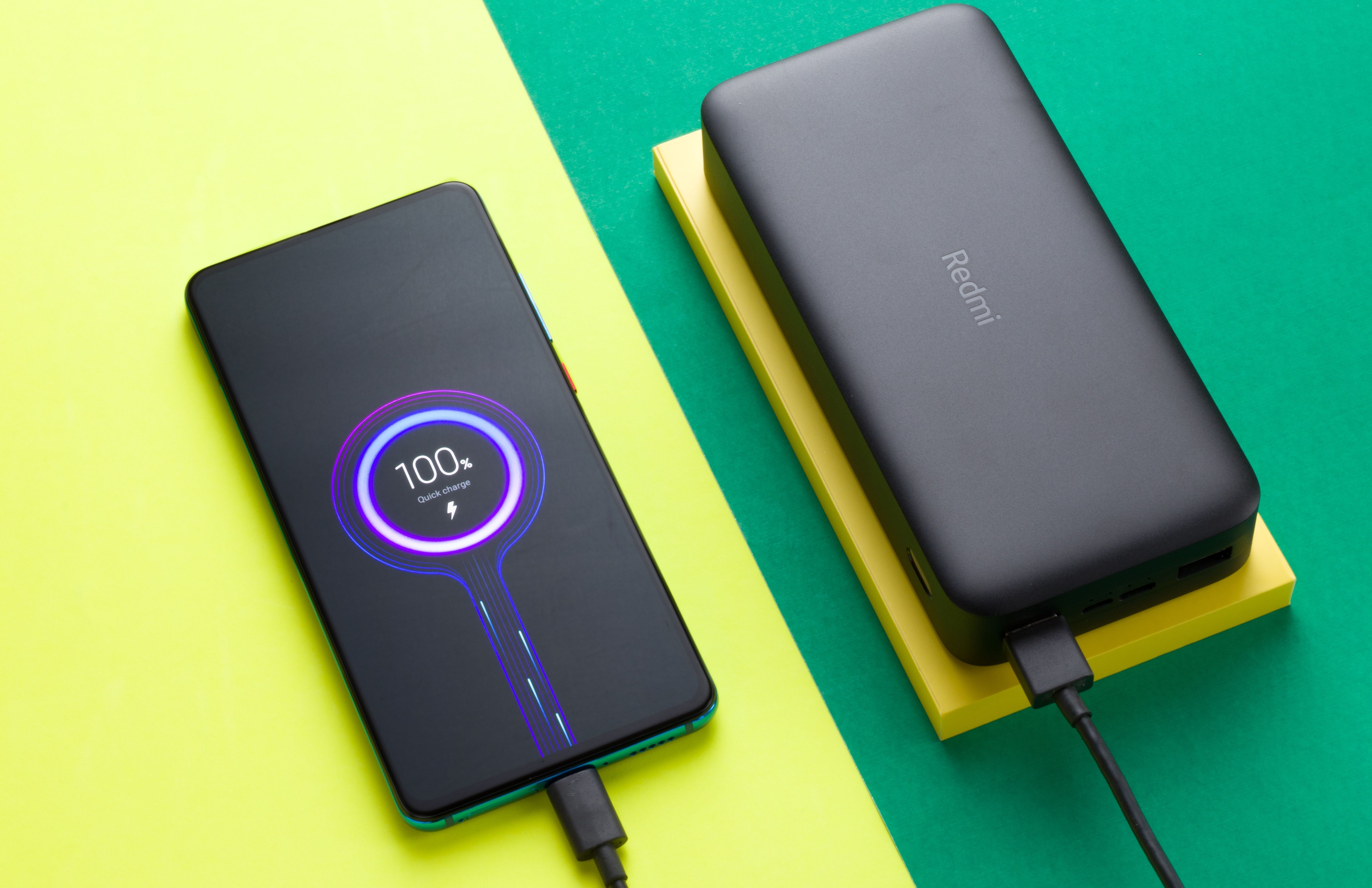 A Redmi powerbank fast charging a Redmi phone