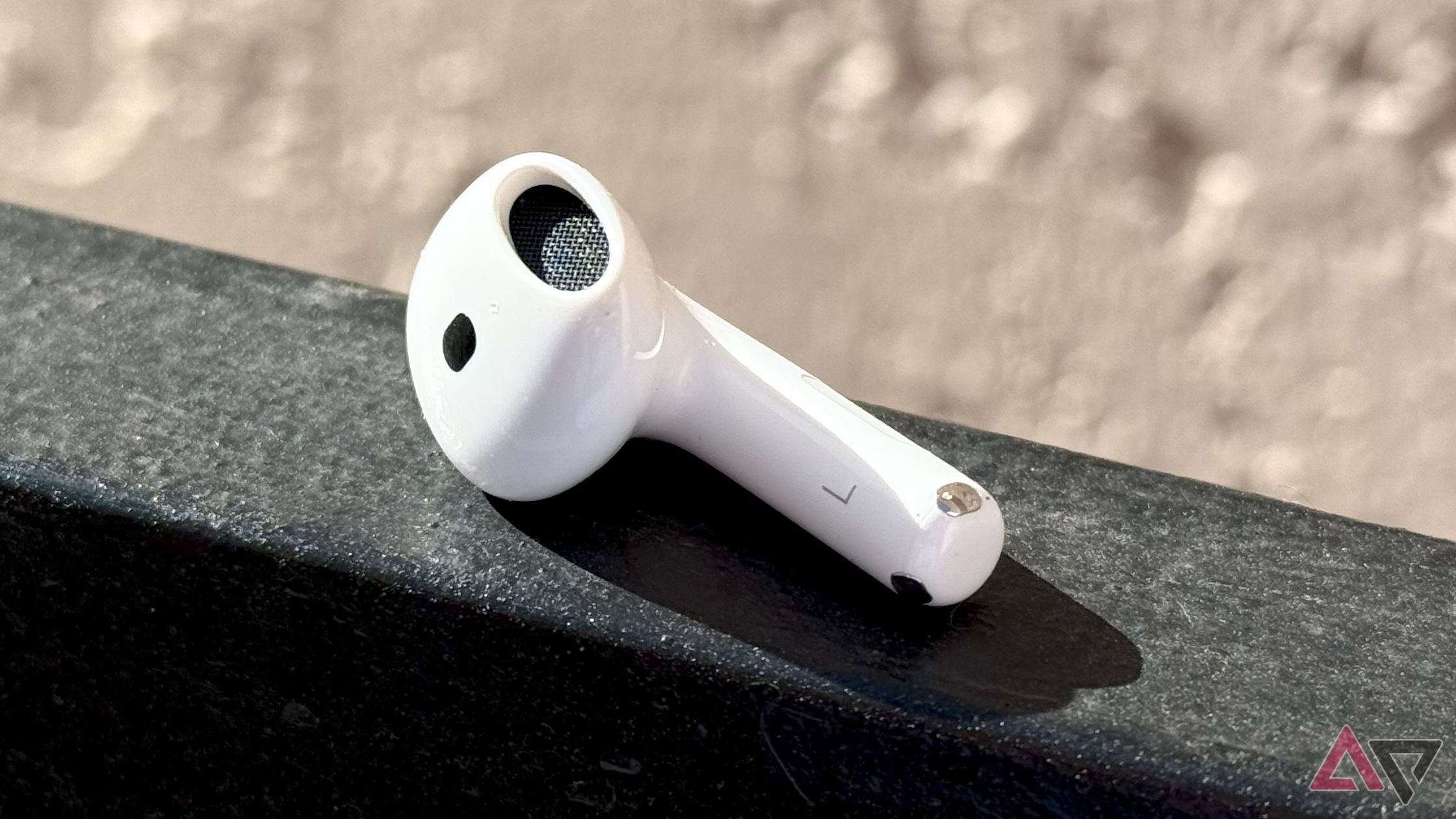 A single earbud of the AirPods 4