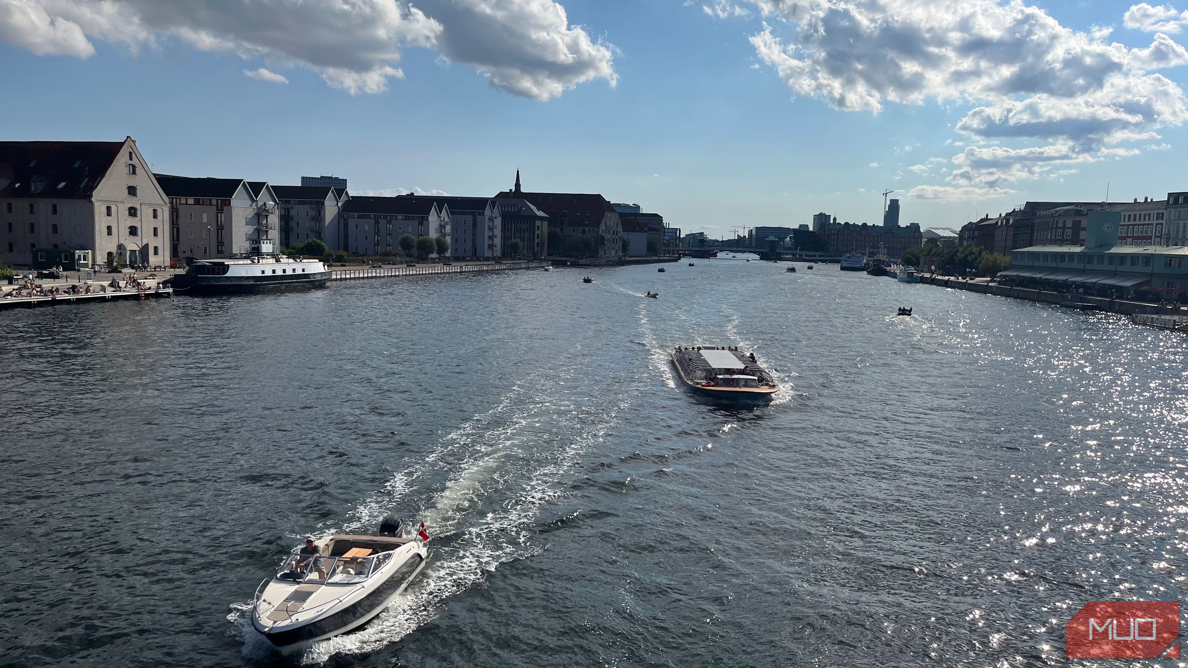 Boats Passing Through a Harbor