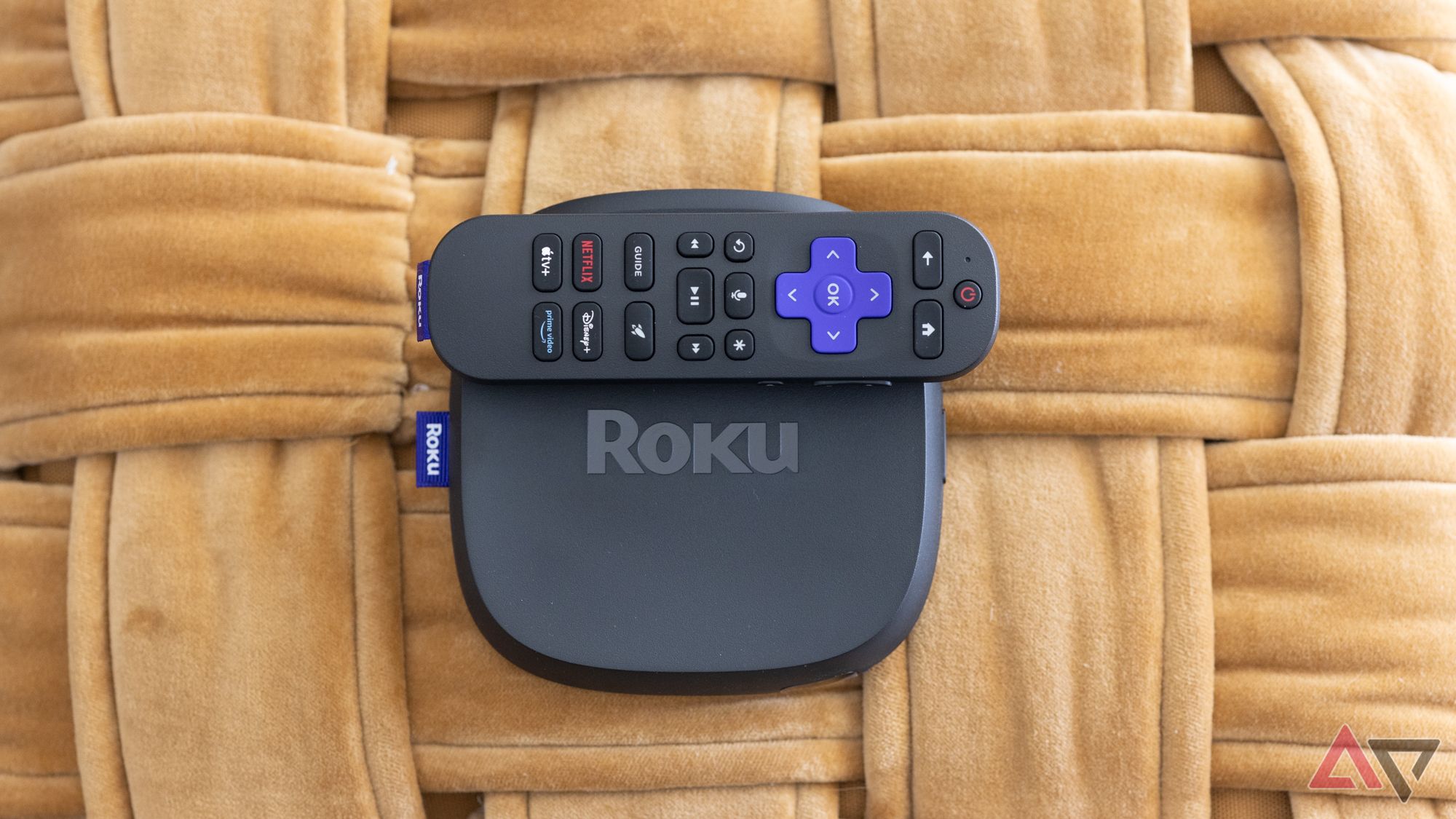 Roku Ultra 2024 Streaming Box and remote on a woven surface