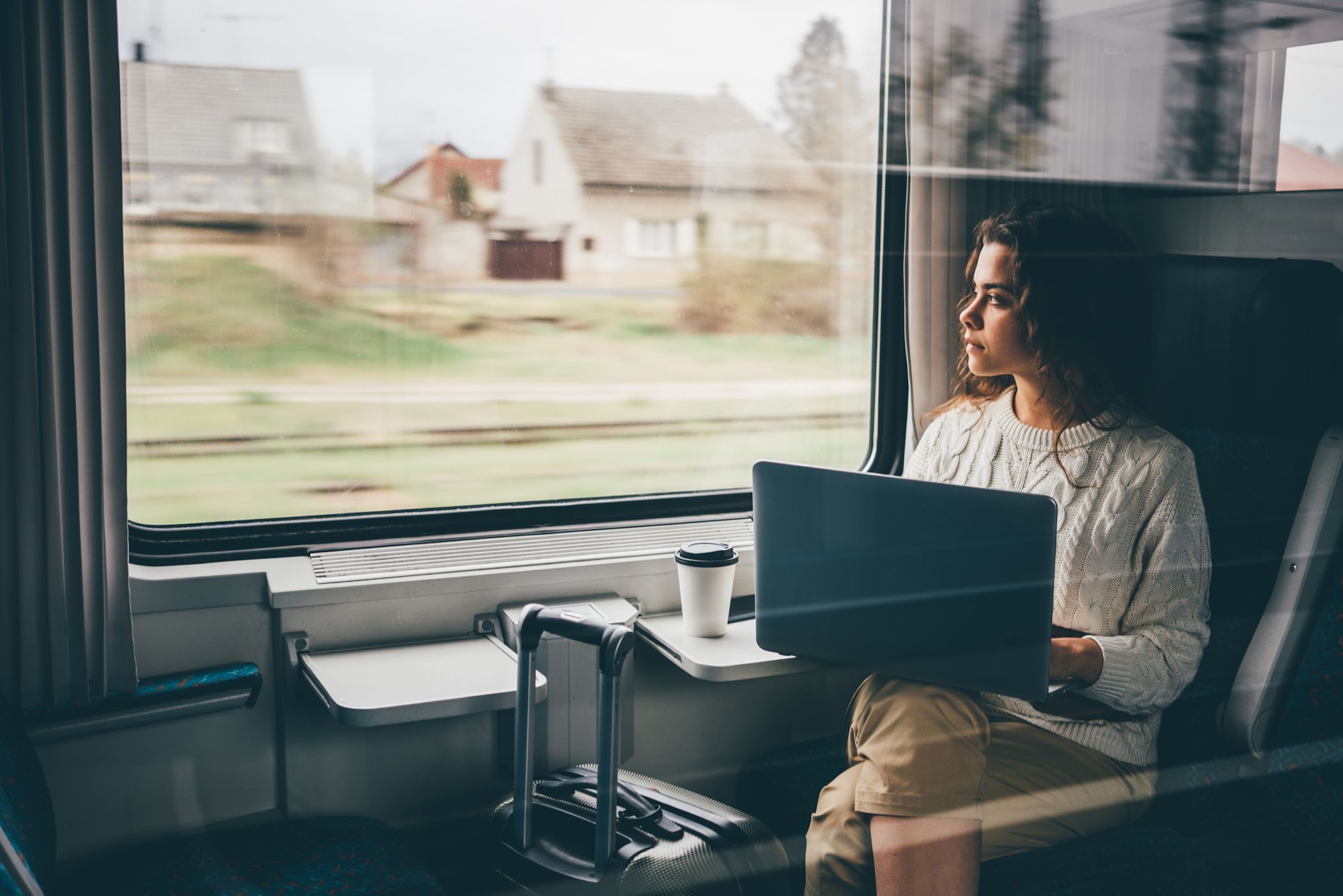 woman using laptop on train