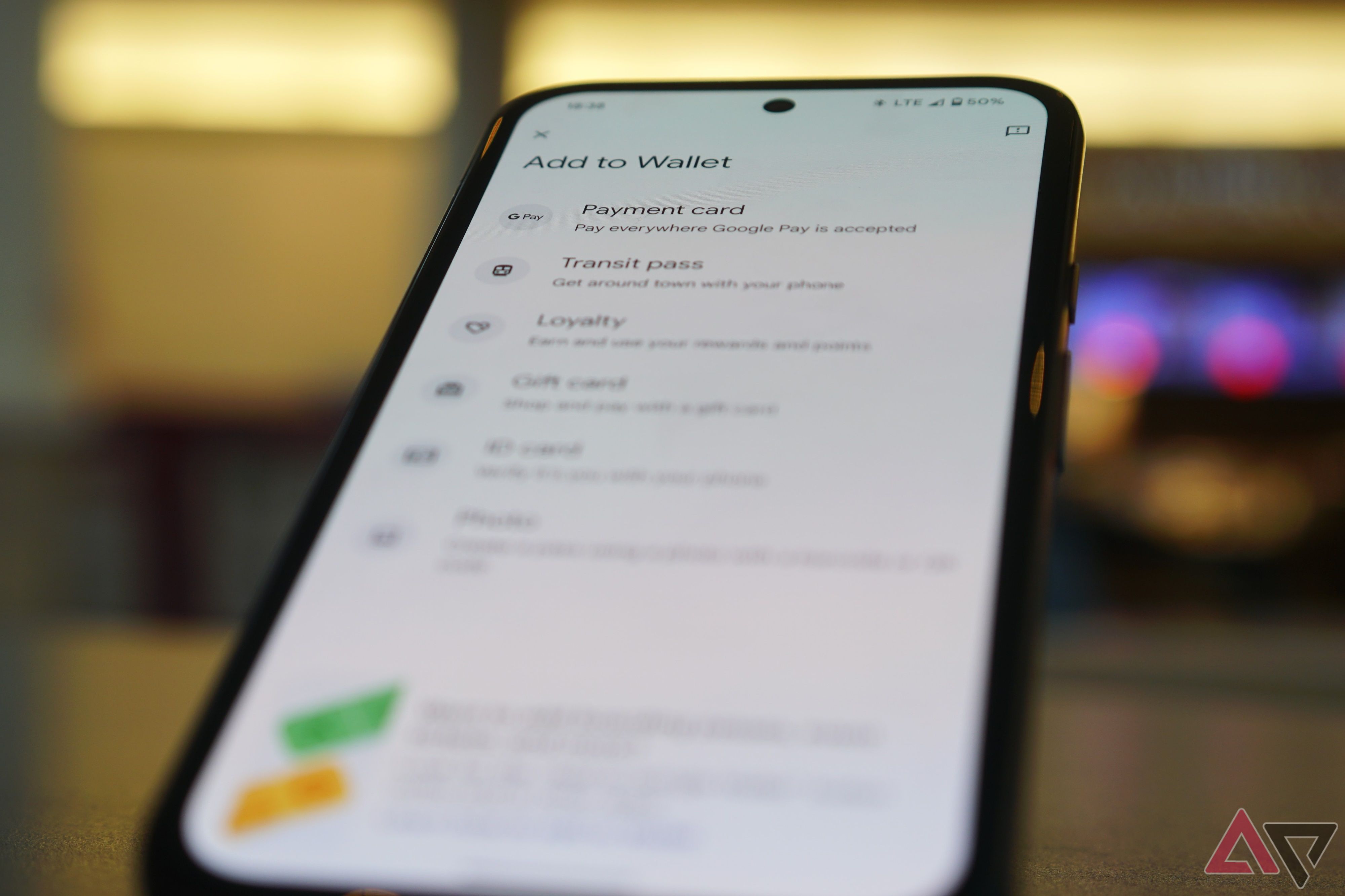 The Add to Wallet screen in the Google Wallet app open on a smartphone, which is slightly out of focus