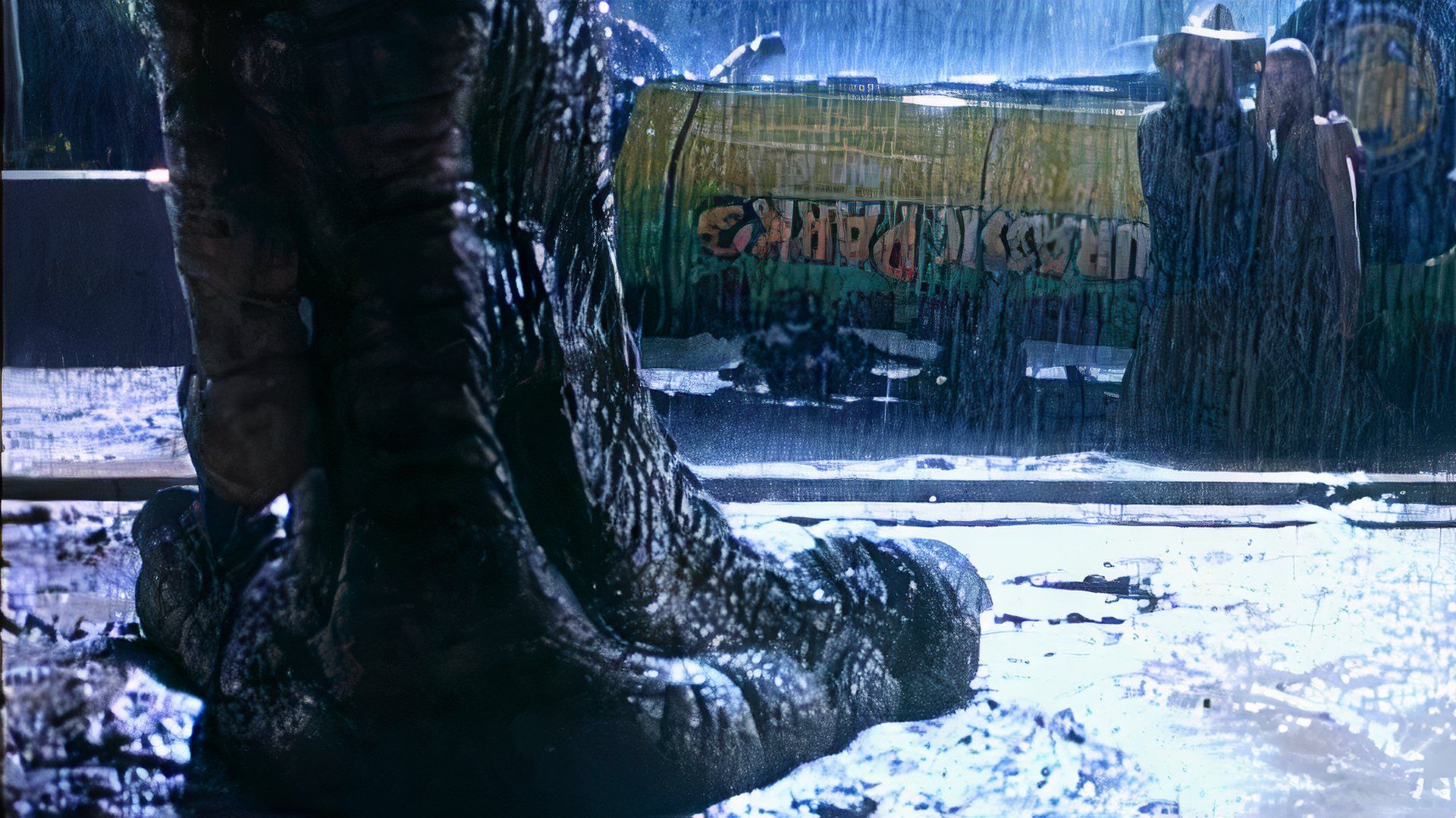 A T. rex foot standing in the mud in the rain in front of Sam Neill's character in Jurassic Park