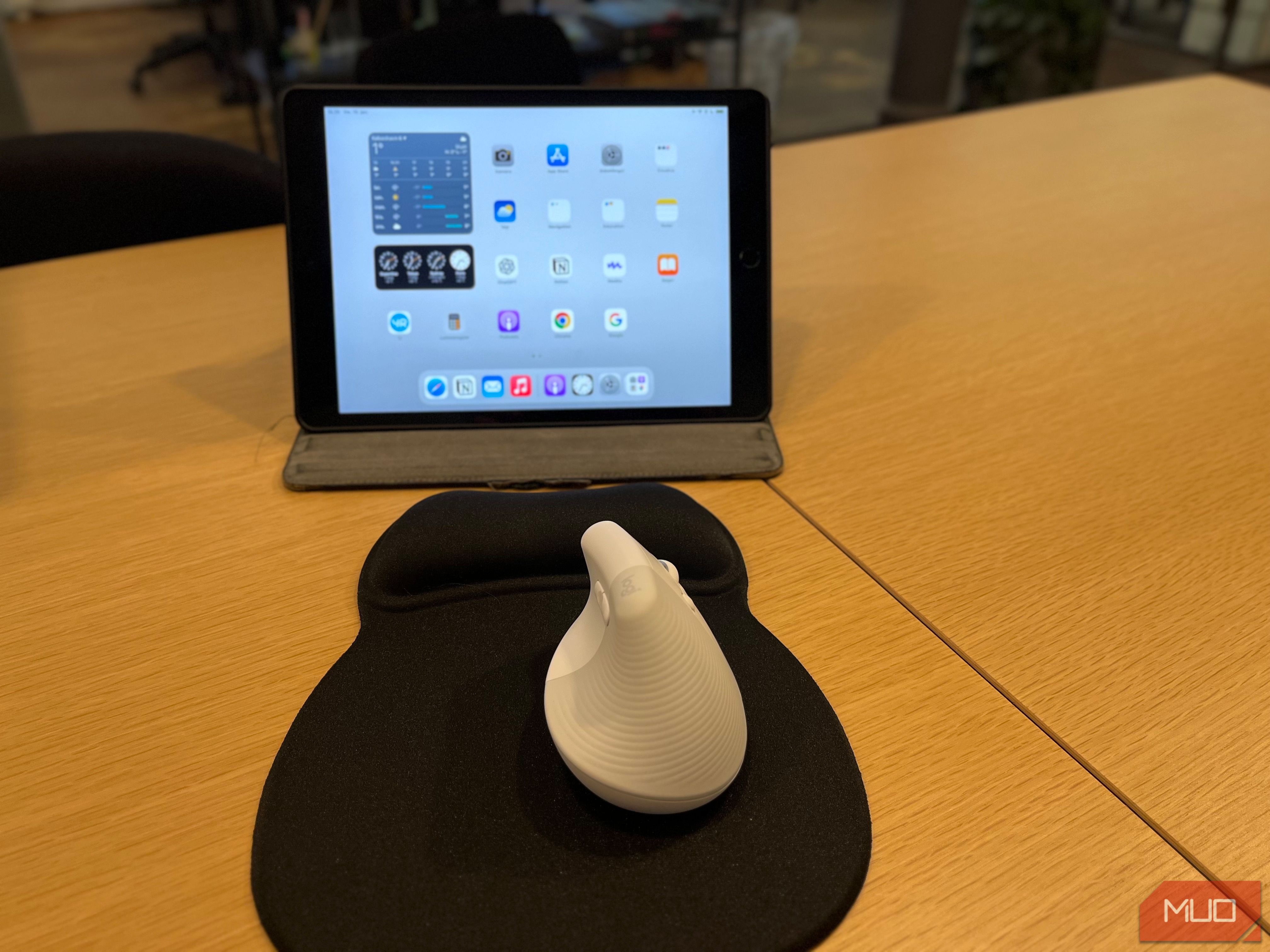 An Image of a iPad and a Wireless Mouse