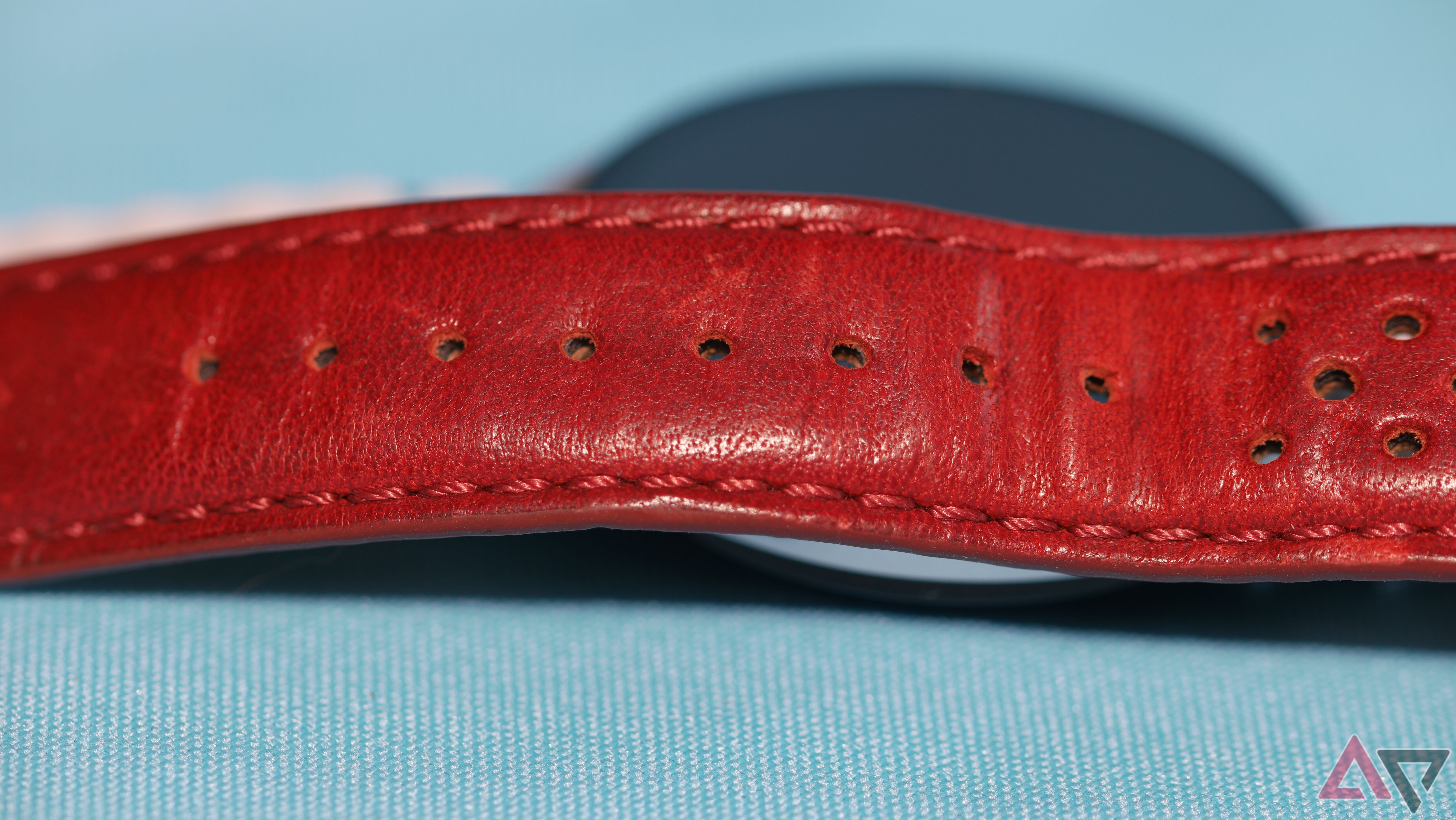 A red Barton Horween Race strap for a smartwatch