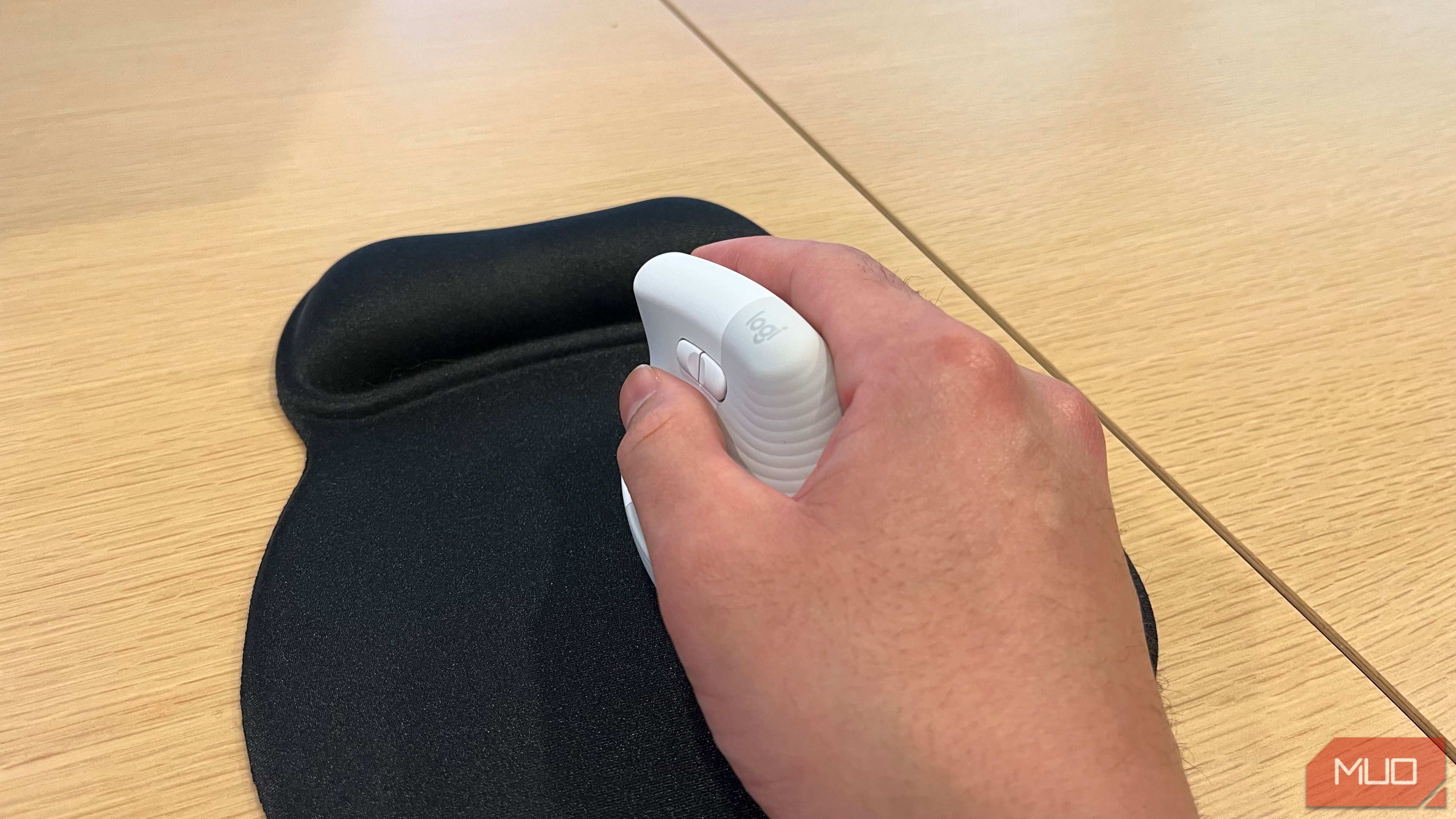 An image of a person using a wireless mouse