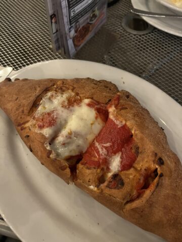 had my first calzone today and i gotta agree with leslie that it is indeed pizza thats harder to eat.jpeg