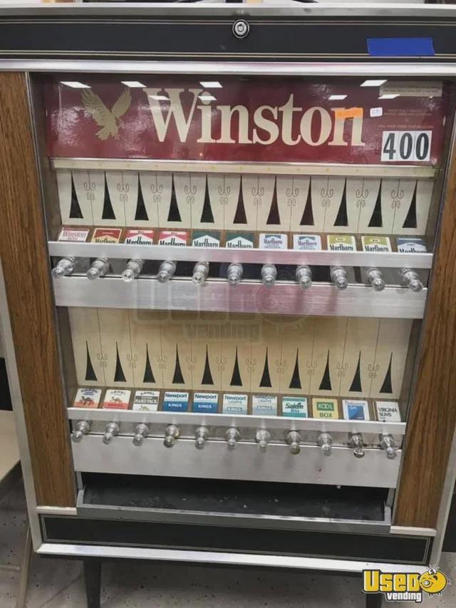buying cigarettes from a vending machine.jpeg