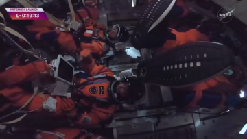 artemis ii astronaut entering a passcode to unlock his mission tablet.png