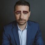 i replaced ben shapiros eyebrows with george michaels mustache.jpeg