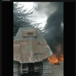 in haiti kenyan special forces are using a bulldozer converted into a tank to attack the base of cannibal general barbecue.png