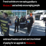 french activists parading fake windows coffin after switching to linux.png