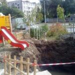 a pit and a playground slide.jpeg