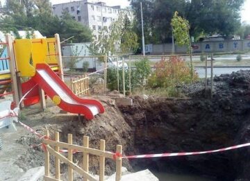a pit and a playground slide.jpeg