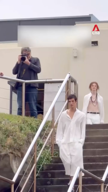 man accidentally walks runway at australia fashion week while heading for a swim.png