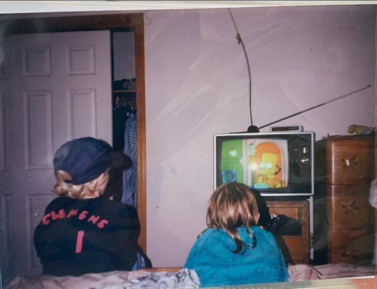 my brother and i in the 90s watching the simpsons.jpeg